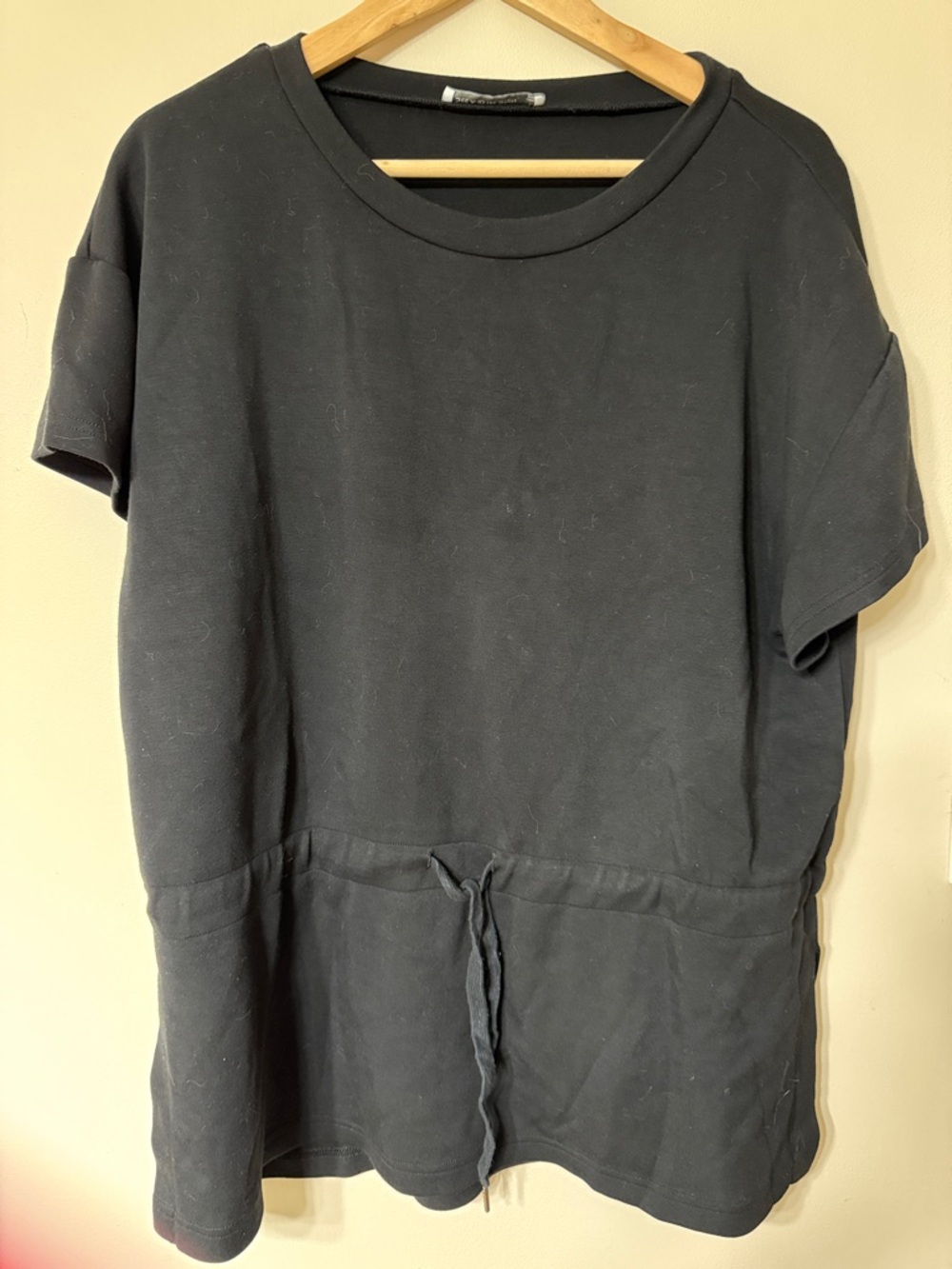 Black shirt or cover up?? Unsure.